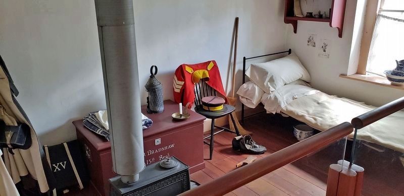 Brick Barracks Interior: Stove, Locker & Bed image. Click for full size.