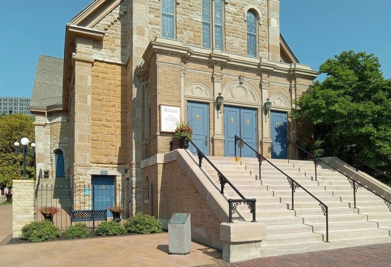 Marker next to the stairs of the Church of Our Lady of Lourdes image. Click for full size.