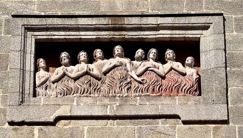 Souls in purgatory relief - detail above entrance image. Click for full size.