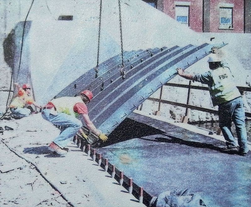 Marker detail: Workers installing hinged crest gates. image. Click for full size.