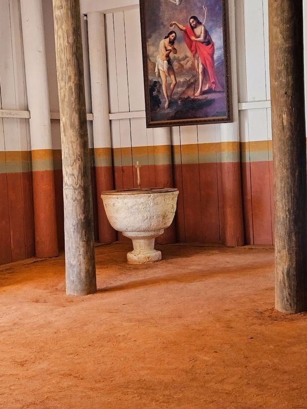 Limestone baptismal font inside the church at San Luis image. Click for full size.