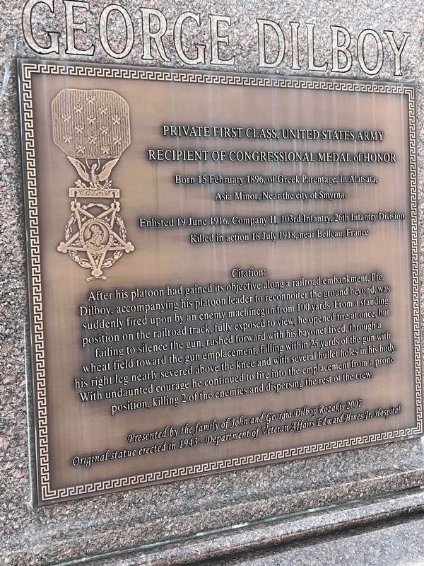 Plaque on north-facing side of statue image. Click for full size.