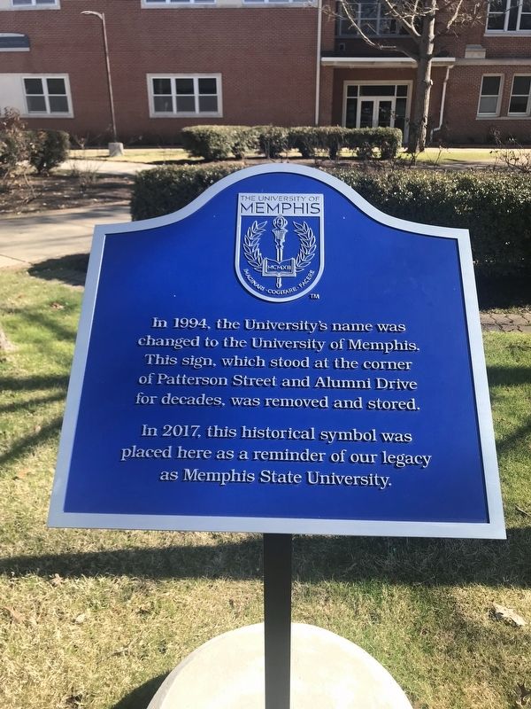 In 1994 the University's name was changed. Marker image. Click for full size.
