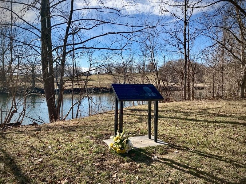 Roscoe Burgess Riverwalk Marker and North River. Click for full size. Roscoe Burgess Riverwalk Marker and North River image. Click for full size.
