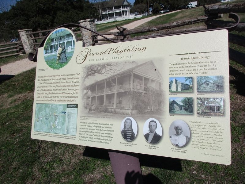 Informational sign, in front of the fence, by the road image. Click for full size.