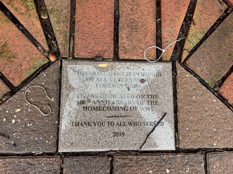 Paver at the base of the memorial image. Click for full size.