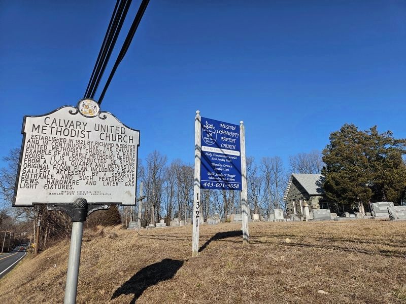 Calvary United Methodist Church Marker with church and graveyard in background image. Click for full size.