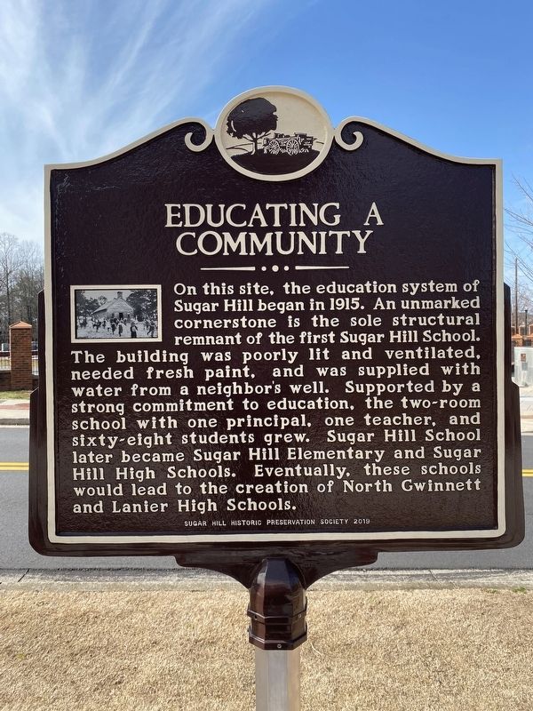 Educating a Community Marker image. Click for full size.