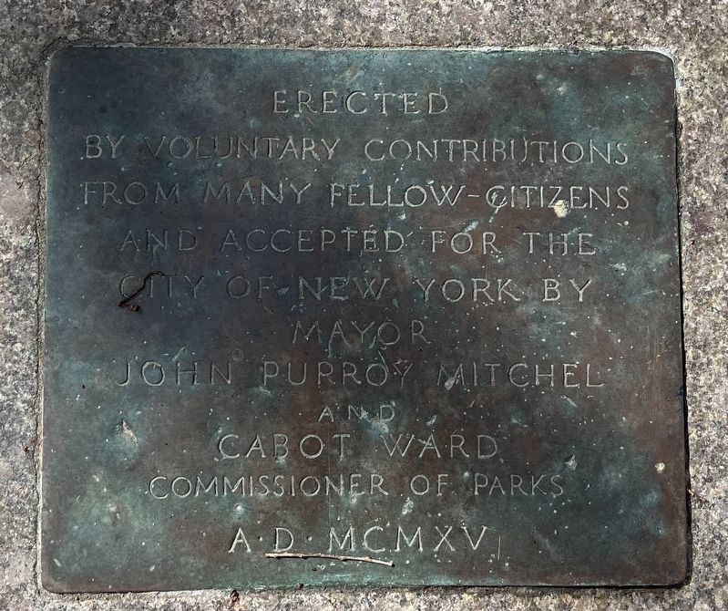Dedication plaque on the sidewalk in front of the sculpture image. Click for full size.