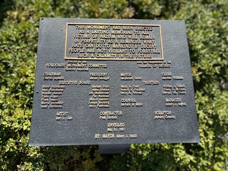 Holocaust Memorial; plaque in front of statue image. Click for full size.