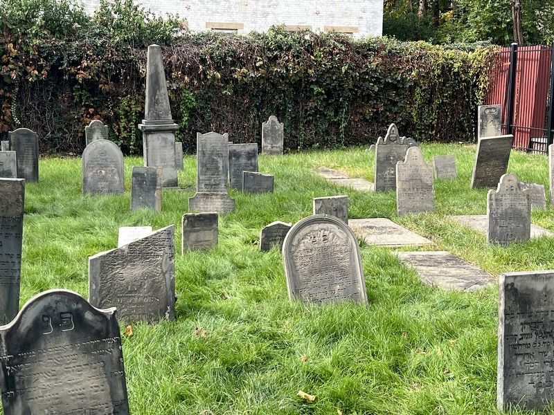 View of cemetery through fence image. Click for full size.