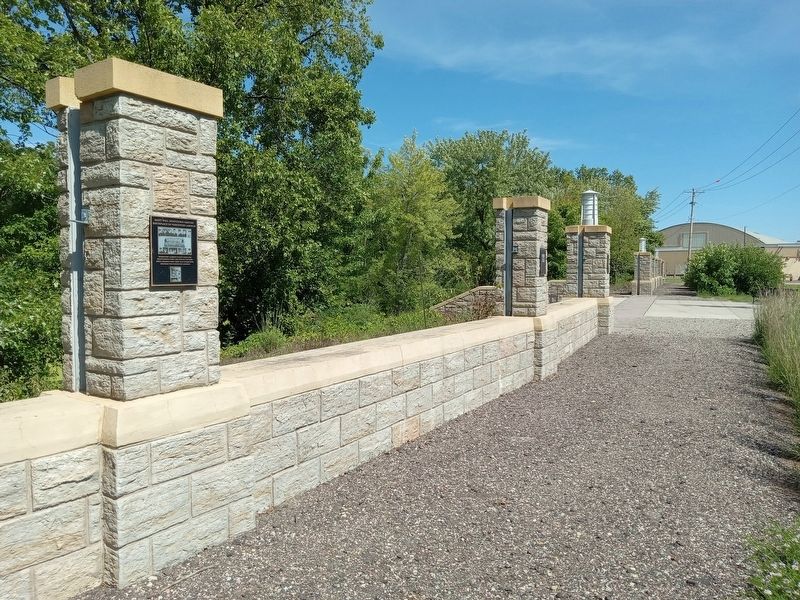 Saint Paul Downtown Airport Marker (left) on the airport floodwall. Click for full size. Saint Paul Downtown Airport Marker (left) on the airport floodwall image. Click for full size.