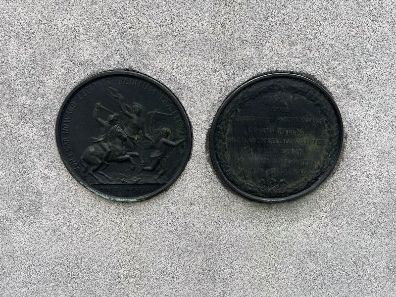 Medallions on the back of the equestrian statue image. Click for full size.