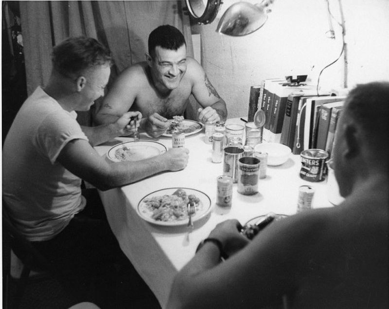 Aquanauts enjoying a meal in SeaLab 1 submerged off Bermuda in 1964: image. Click for full size.