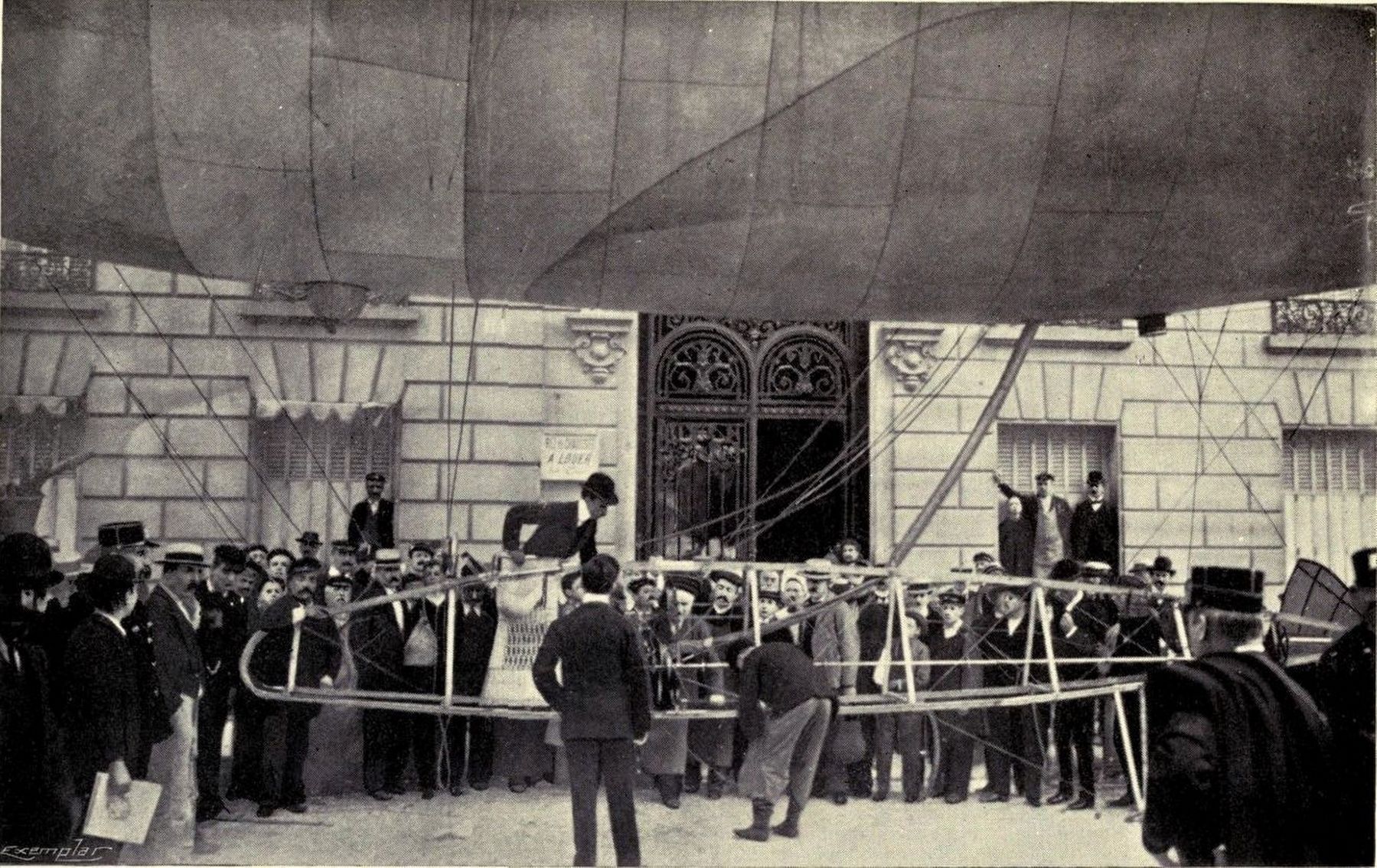 Albert Santos Dumont lands at his own door (114 Avenue Champs lyse) with Dirigible No. 9 image. Click for full size.
