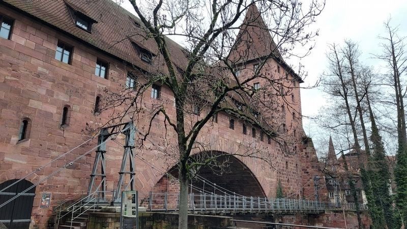 The marker in front of the chain bridge (Kettensteg) over the river. Click for full size. The marker in front of the chain bridge (Kettensteg) over the river image. Click for full size.