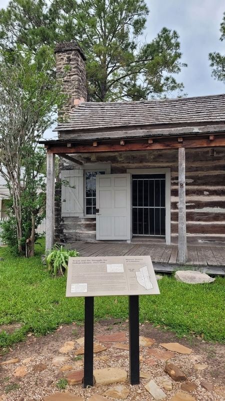 The Texas and the Struggle for Independence Marker in front of the Abram Alley Log Cabin image. Click for full size.