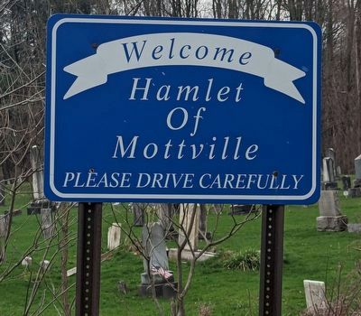 Welcome to Mottville sign near cemetery image. Click for full size.