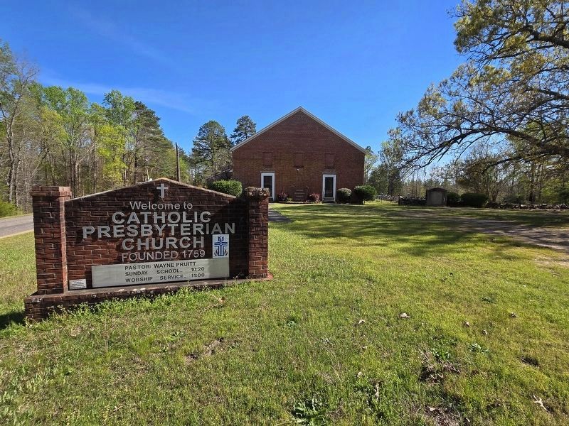 Catholic Presbyterian Church sign and church image. Click for full size.