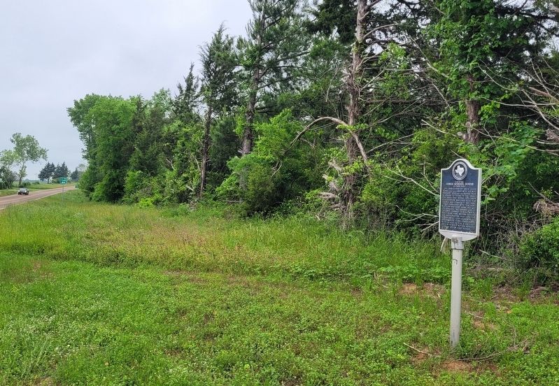 The view of the Site of the Jones School House Marker along the highway image. Click for full size.