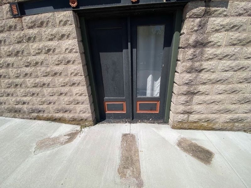 The original main entrance-opening out onto Church Street, notice the fish imprints in the pavement.. Click for full size. The original main entrance-opening out onto Church Street, notice the fish imprints in the pavement. image. Click for full size.