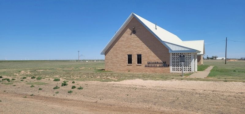 Rhea Community Marker with cemetery in the background of the left of the photo. image. Click for full size.