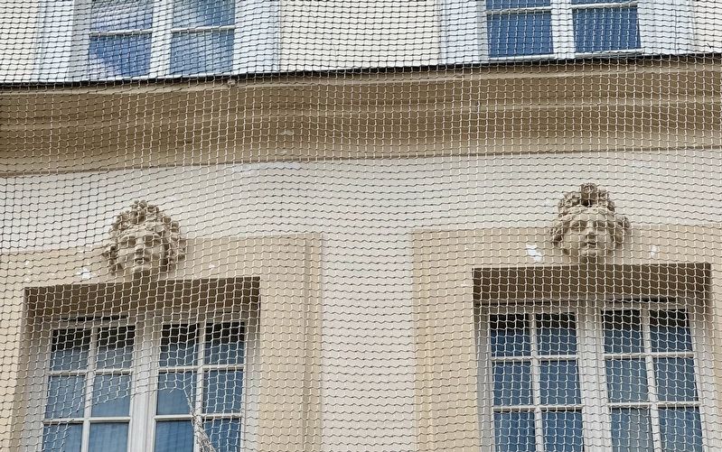 Two mascarons image. Click for full size.