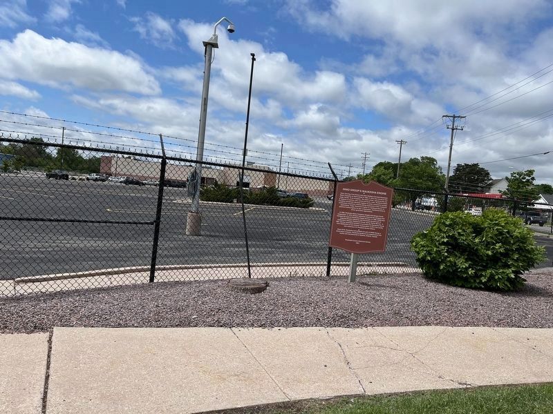 INNIO Group's Waukesha Engine Marker and company building in the background image. Click for full size.