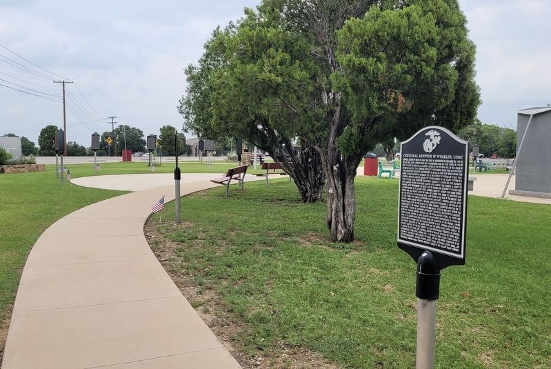 The view of the Corporal Kennith W Wheeler, USMC Marker along the pathway image. Click for full size.
