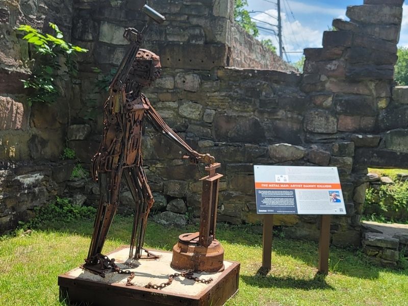 The Metal Man and His Marker. Click for full size. The Metal Man and His Marker image. Click for full size.