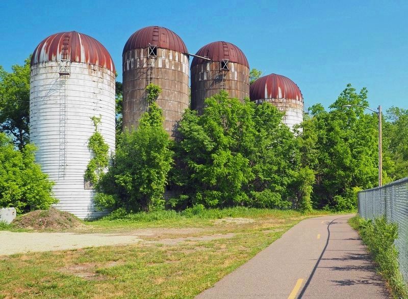 The marker is just around the bend past these silos. Click for full size. The marker is just around the bend past these silos image. Click for full size.