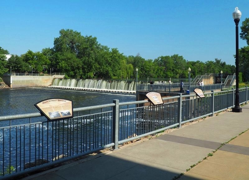 Main Street Bridge Marker (left) overlooking the Rum River Dam. Click for full size. Main Street Bridge Marker (left) overlooking the Rum River Dam image. Click for full size.