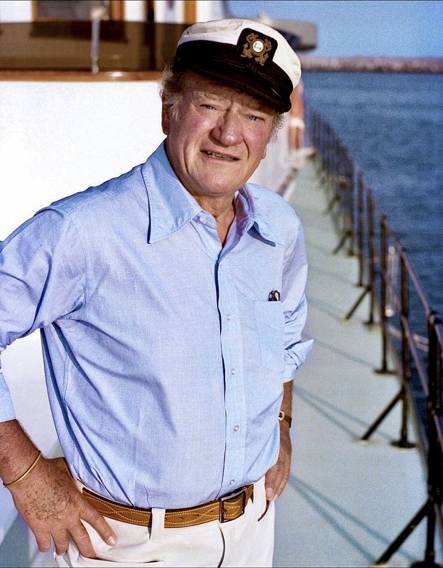 John Wayne aboard his Wild Goose image. Click for full size.