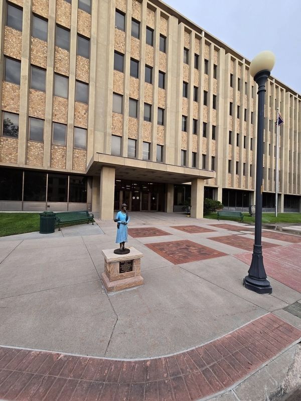 Nellie Tayloe Ross statue in front of the Hathaway Building. Click for full size. Nellie Tayloe Ross statue in front of the Hathaway Building image. Click for full size.