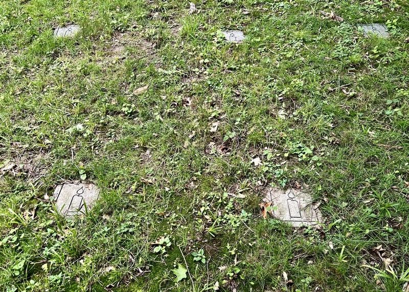 Candles marking the location of graves in the cemetery image. Click for full size.