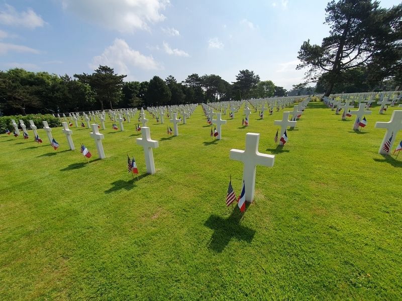 Decorated graves near the Normandy American Cemetery Chapel. Click for full size. Decorated graves near the Normandy American Cemetery Chapel image. Click for full size.