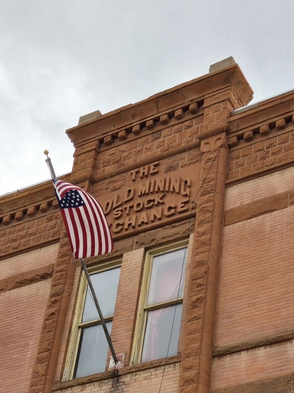 The Gold Mining Stock Exchange lettering on the parapet image. Click for full size.