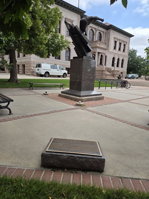 Colorado Springs Pioneer Museum in the background of the Colorado Skiing markers and statue image. Click for full size.