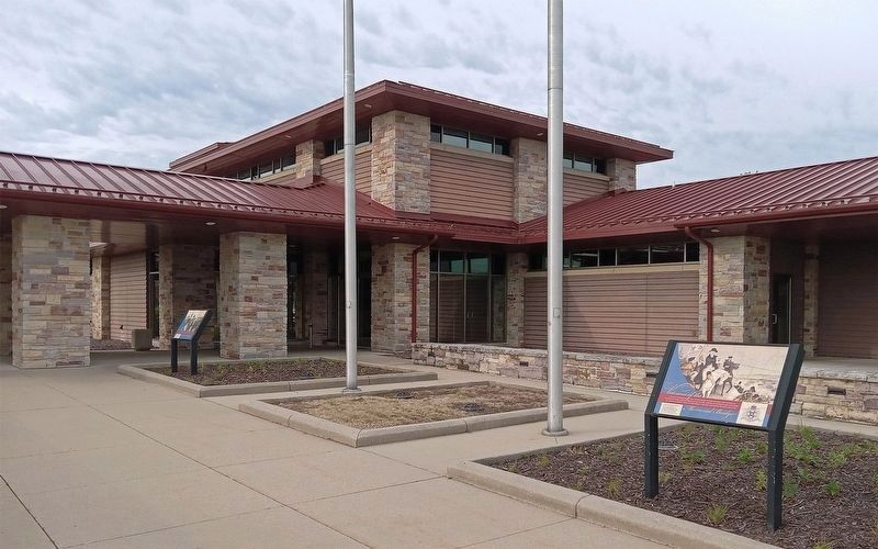Wisconsin Veterans Memorial Highway marker (left) at Rest Area 11 image. Click for full size.