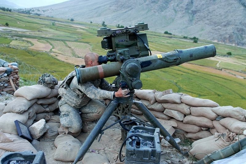 TOW Missile tube launcher installed on a tripod on the ground. Click for full size. TOW Missile tube launcher installed on a tripod on the ground image. Click for full size.
