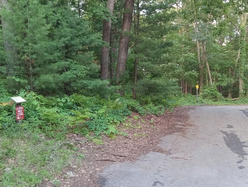 Eroding Sandstone Bluffs Marker at the end of the east park road image. Click for full size.