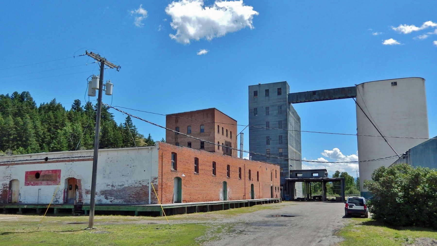 Flour Warehouse (1912), Story Mill (c. 1904), Grain Elevator (c. 1903), & Concrete Grain Bins (1927). Click for full size. Flour Warehouse (1912), Story Mill (c. 1904), Grain Elevator (c. 1903), & Concrete Grain Bins (1927) image. Click for full size.