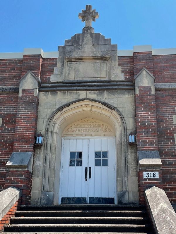 Close up of building behind the marker noted as "Mother Mary Mission". image. Click for full size.