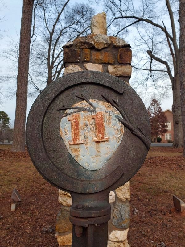 Mile marker at the edge of the church property image. Click for full size.