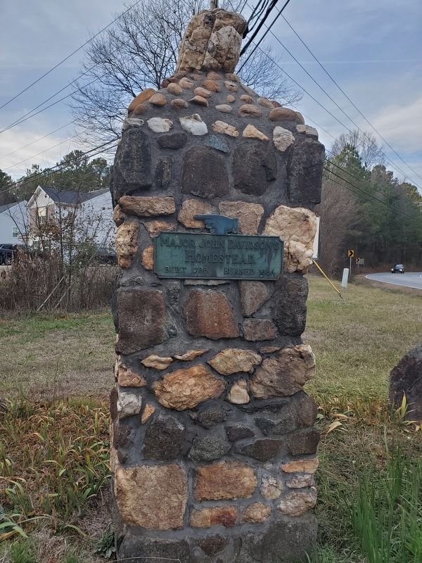 Directional sign on stone pillar near the Davidson marker image. Click for full size.