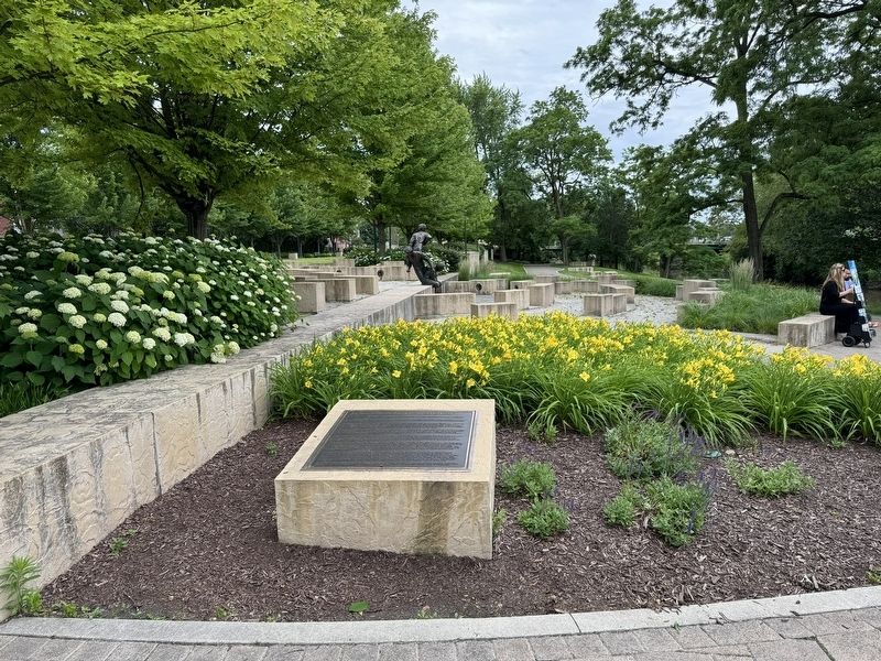 Marker located within a flower bed image. Click for full size.