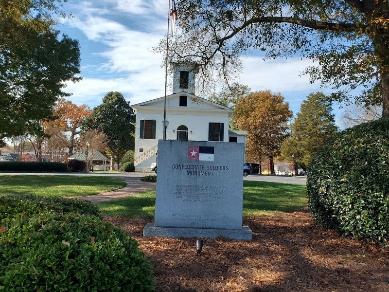 Wide view Confederate Soldiers Monument. Old Gaston County Courthouse in background. Click for full size. Wide view Confederate Soldiers Monument. Old Gaston County Courthouse in background image. Click for full size.
