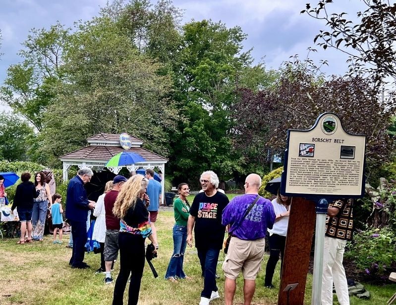 Bethel Marker in context with a piece of the original Woodstock Festival stage floor leaning on it.. Click for full size. Bethel Marker in context with a piece of the original Woodstock Festival stage floor leaning on it. image. Click for full size.