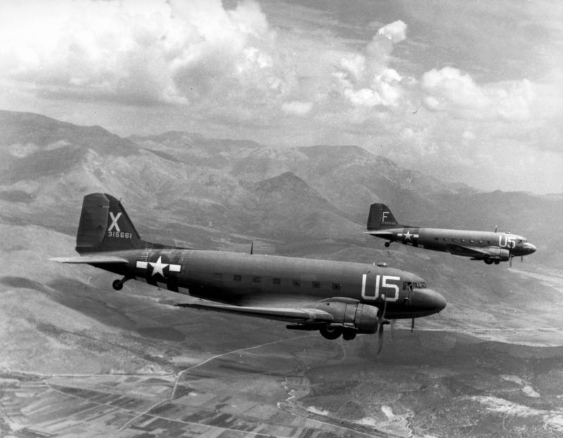 Two C-47 "Skytrain" in flight image. Click for full size.