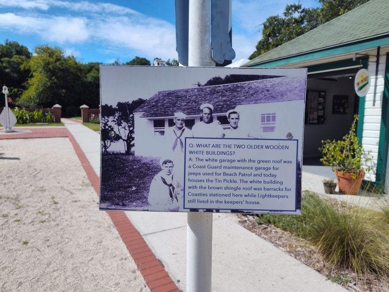 Q: What Are The Two Older Wooden White Buildings? Marker image. Click for full size.